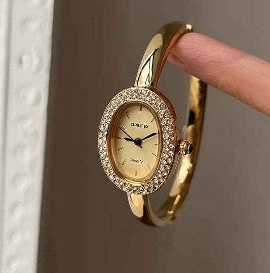 Vintage-Inspired Diamond Gold Oval Watch for Women Roman Numeral Dial Bangle Watch