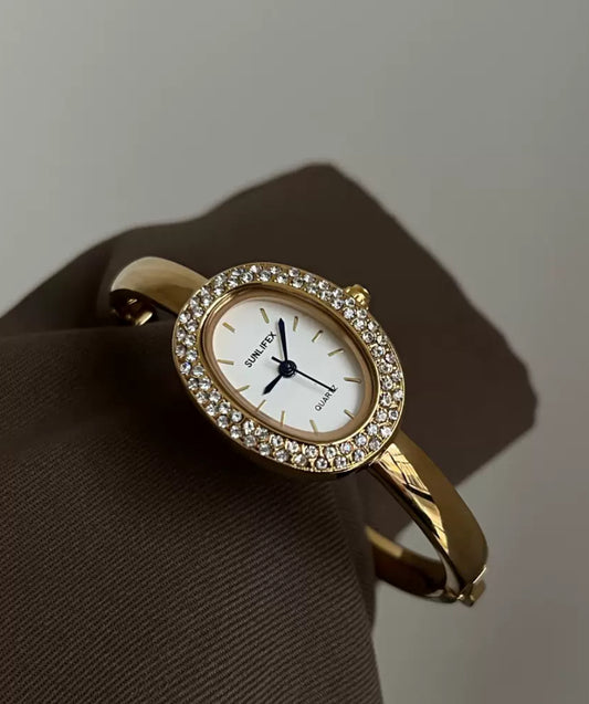 Vintage-Inspired Diamond Gold Oval Watch for Women Roman Numeral Dial Bangle Watch